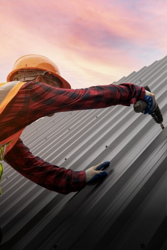 Roofer Installing Metal Roofing